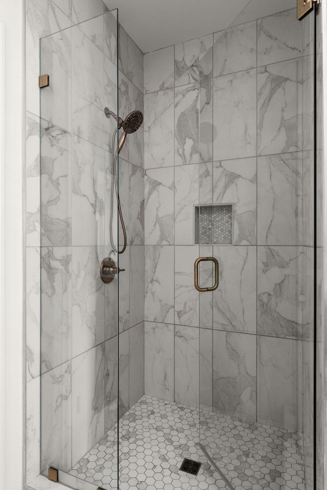 bathroom featuring a shower stall