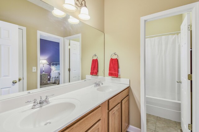 full bathroom with shower / tub combo with curtain, tile patterned flooring, a sink, and double vanity