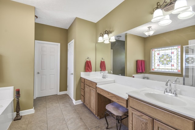 full bath featuring double vanity, a bath, baseboards, and a sink