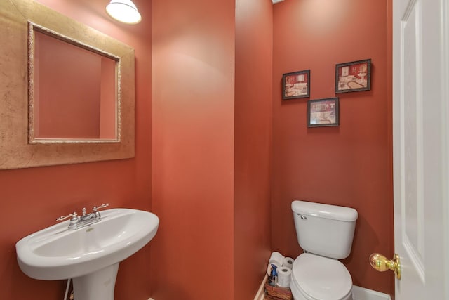 bathroom featuring toilet and a sink