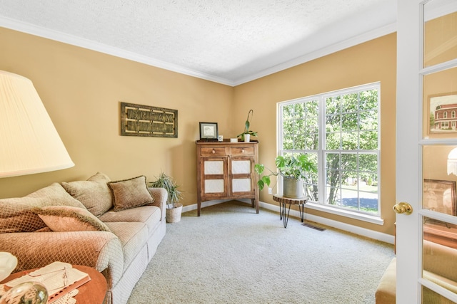 carpeted living room featuring baseboards, ornamental molding, a textured ceiling, and visible vents