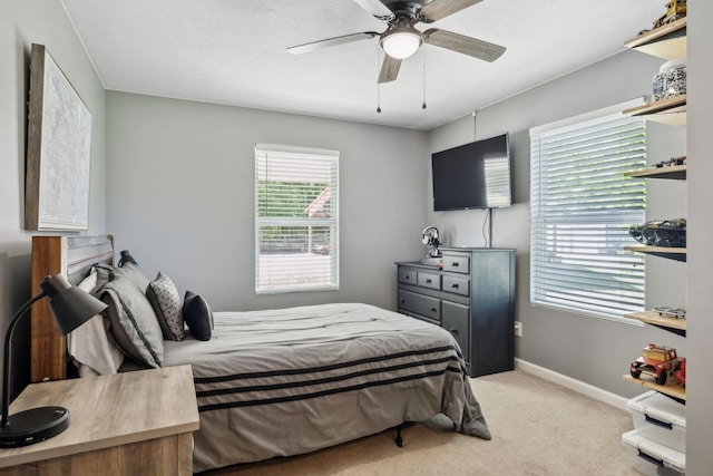 7565 N County Line Rd, Fairview, TN 37062 - bedroom with light colored carpet, a ceiling fan, and baseboards