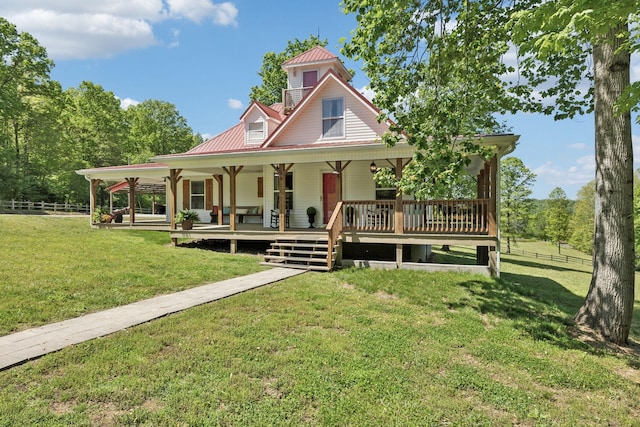 7565 N County Line Rd, Fairview, TN 37062 - farmhouse inspired home featuring a front lawn, fence, covered porch, and metal roof