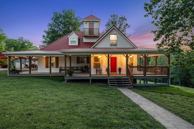 7565 N County Line Rd, Fairview, TN 37062 - back of house at dusk with an outdoor structure, a yard, a porch, and metal roof