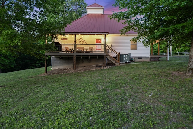 7565 N County Line Rd, Fairview, TN 37062 - back of property at dusk featuring a wooden deck, a yard, stairway, and metal roof
