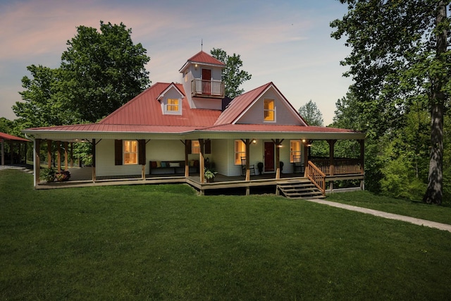 7565 N County Line Rd, Fairview, TN 37062 - farmhouse inspired home with covered porch, metal roof, and a front lawn