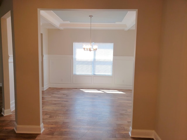 2260 Viking Ct, Murfreesboro, TN 37127 - empty room with wood finished floors, a decorative wall, a wainscoted wall, and a notable chandelier
