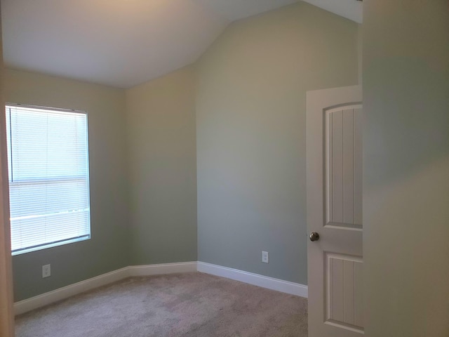 2260 Viking Ct, Murfreesboro, TN 37127 - spare room featuring baseboards, vaulted ceiling, and light colored carpet
