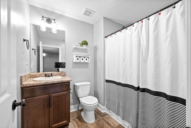 bathroom featuring a textured ceiling, toilet, visible vents, tile patterned flooring, and vanity