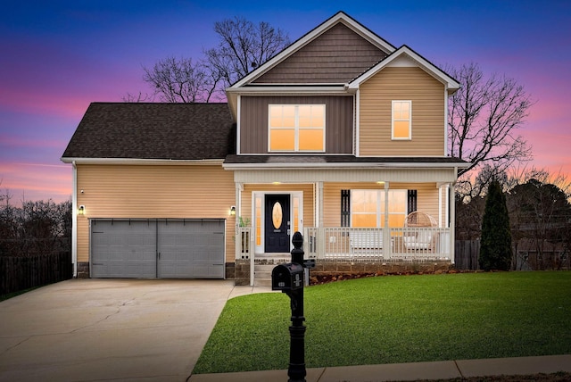 view of front of home featuring fence, a lawn, driveway, and covered porch