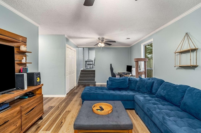 5148 Roxborough Dr, Hermitage, TN 37076 - living room with light wood finished floors, a ceiling fan, a textured ceiling, and stairs
