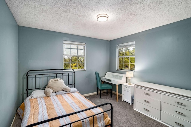 5148 Roxborough Dr, Hermitage, TN 37076 - bedroom featuring dark carpet, a textured ceiling, and baseboards