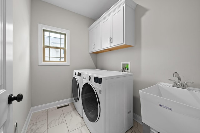 1885 Shield Dr, Clarksville, TN 37043 - laundry room with marble finish floor, a sink, baseboards, separate washer and dryer, and cabinet space