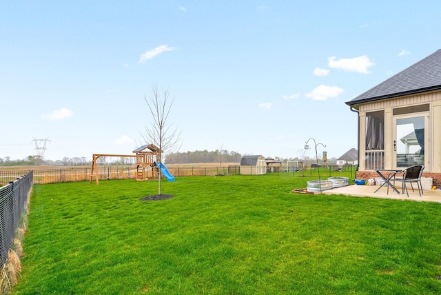 1885 Shield Dr, Clarksville, TN 37043 - view of yard with a fenced backyard, a patio area, and a playground
