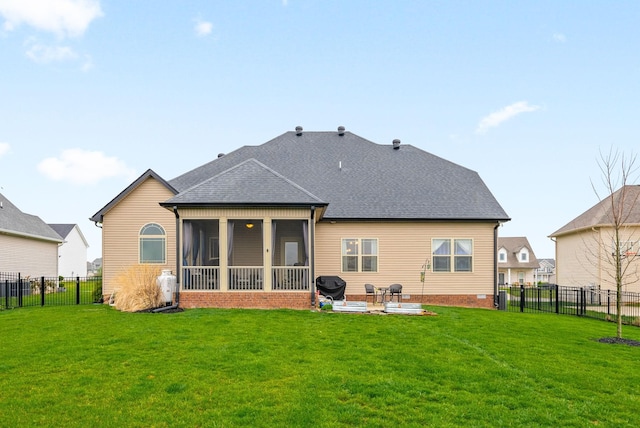 1885 Shield Dr, Clarksville, TN 37043 - back of property featuring a lawn, a fenced backyard, a patio, and a shingled roof