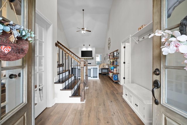 1885 Shield Dr, Clarksville, TN 37043 - entrance foyer featuring ceiling fan, wood finished floors, high vaulted ceiling, and stairway