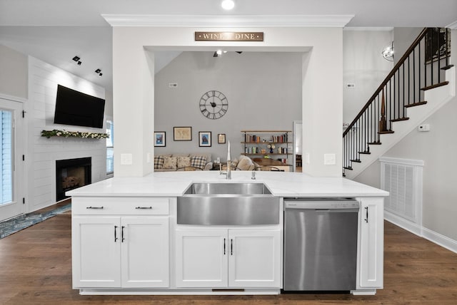 1885 Shield Dr, Clarksville, TN 37043 - kitchen with stainless steel dishwasher, a sink, open floor plan, light stone countertops, and visible vents