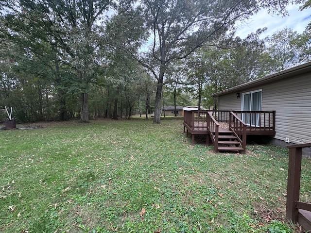 view of yard featuring a wooden deck