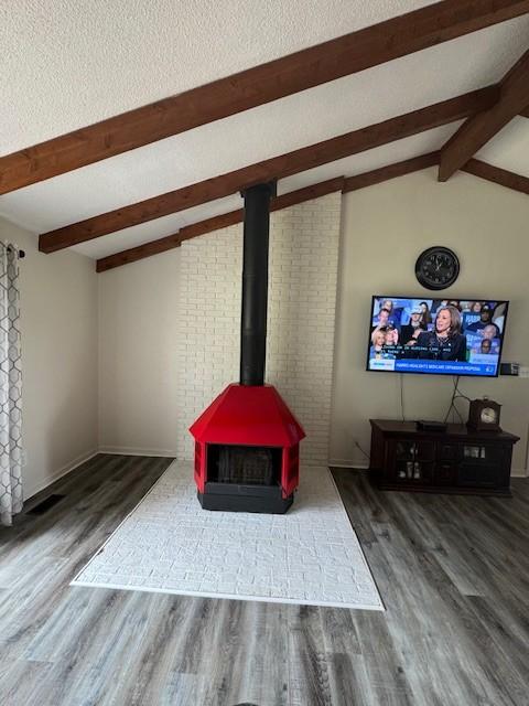 details with beamed ceiling, baseboards, and wood finished floors