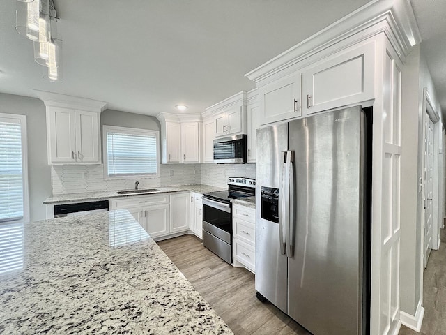 402 Pine St A/B, Unit A/B Pulaski, TN 38478 - kitchen with stainless steel appliances, a sink, and white cabinets
