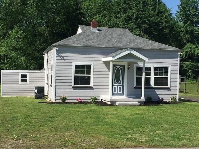 114 Hamblen Ave, Old Hickory, TN 37138 - view of front of property featuring central air condition unit, a front lawn, a chimney, and a shingled roof