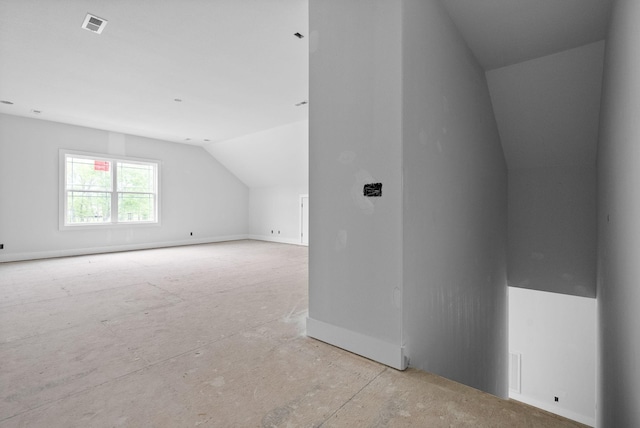 bonus room with vaulted ceiling and visible vents