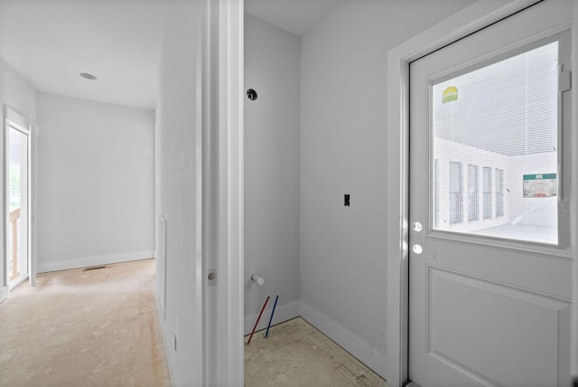interior space with a healthy amount of sunlight, baseboards, and visible vents
