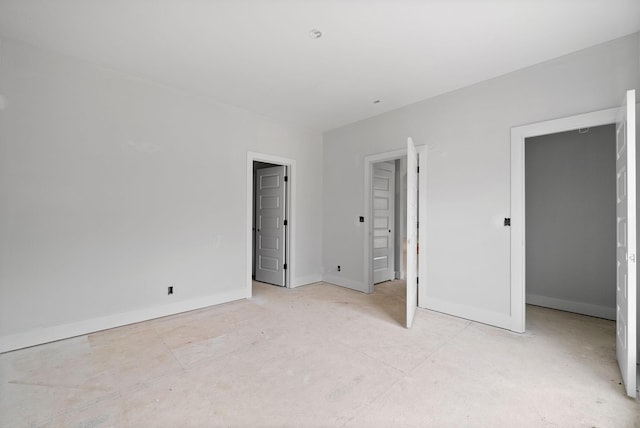 unfurnished bedroom featuring baseboards