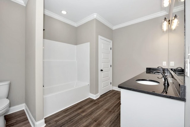 full bathroom with crown molding, wood finished floors, a sink, and toilet