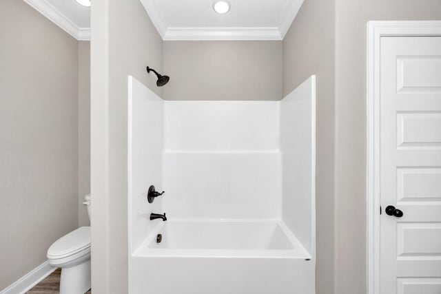 bathroom featuring shower / washtub combination, wood finished floors, crown molding, and toilet
