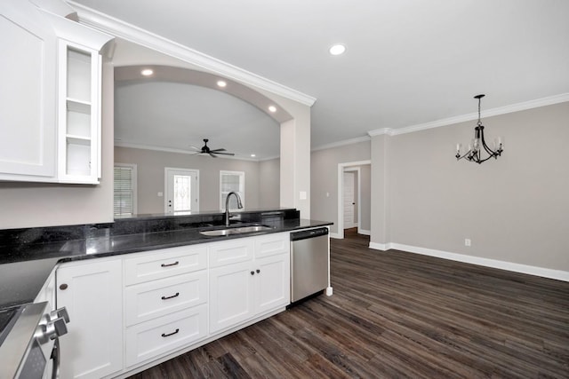 kitchen with white cabinets, ceiling fan with notable chandelier, stainless steel appliances, and a sink