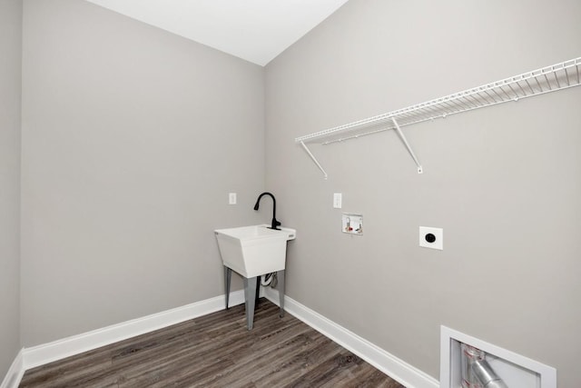 laundry area featuring hookup for a washing machine, hookup for an electric dryer, baseboards, dark wood-type flooring, and laundry area