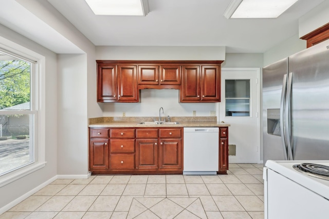 170 Wessington Pl, Hendersonville, TN 37075 - kitchen with a sink, light tile patterned flooring, white appliances, light countertops, and baseboards