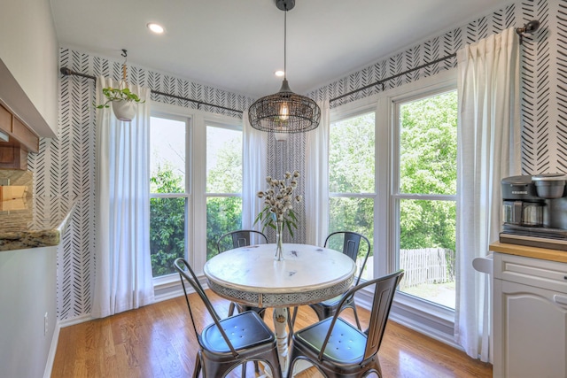 dining space featuring recessed lighting and light wood-type flooring
