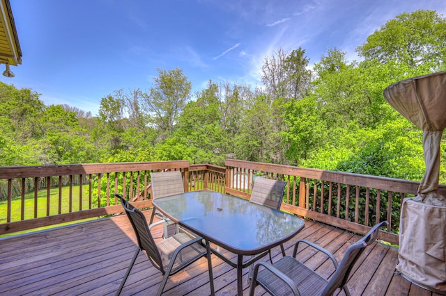wooden deck featuring outdoor dining space