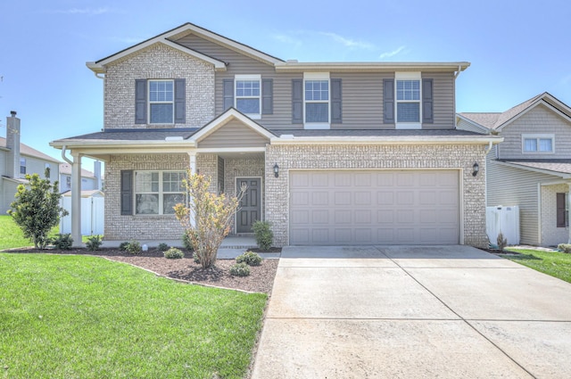 view of front facade featuring a garage, brick siding, a front yard, and concrete driveway