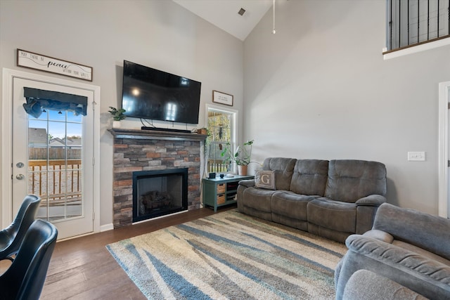 406 Bender Ct, Clarksville, TN 37042 - living room with visible vents, wood finished floors, ceiling fan, a stone fireplace, and high vaulted ceiling