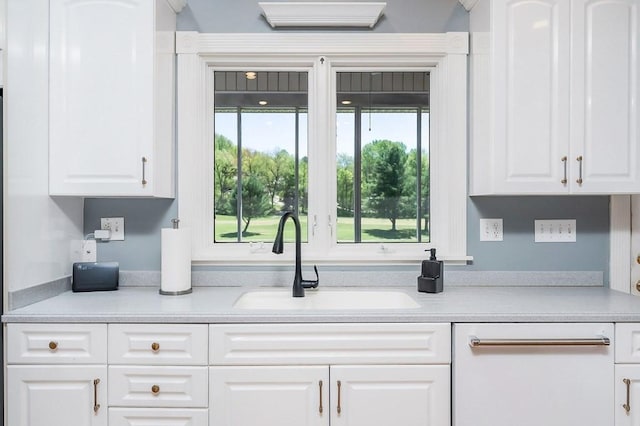 1319 N Plantation Dr, Cookeville, TN 38506 - kitchen with white cabinetry, a sink, and light countertops