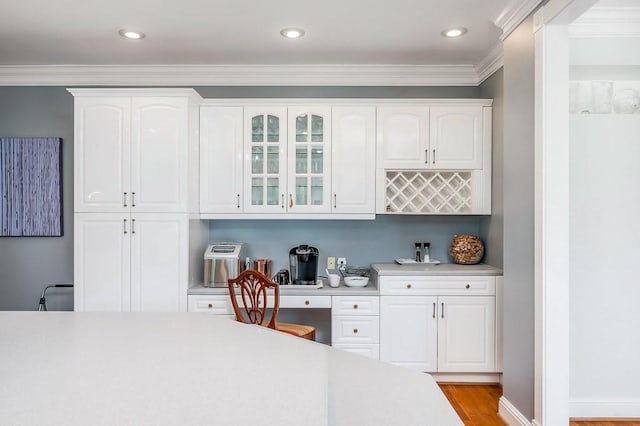1319 N Plantation Dr, Cookeville, TN 38506 - bar featuring recessed lighting, ornamental molding, light wood-style floors, and built in desk