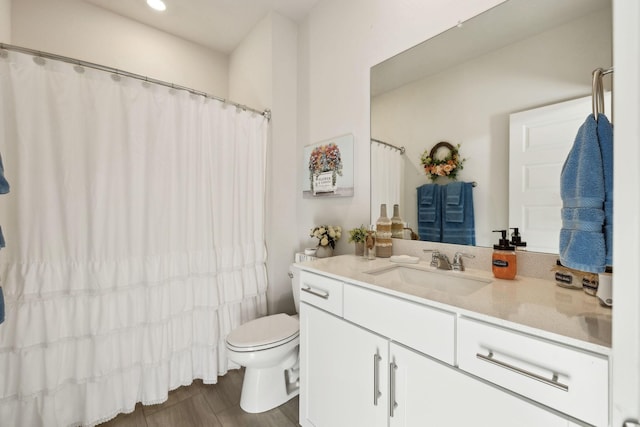 full bathroom featuring vanity, recessed lighting, a shower with shower curtain, and toilet