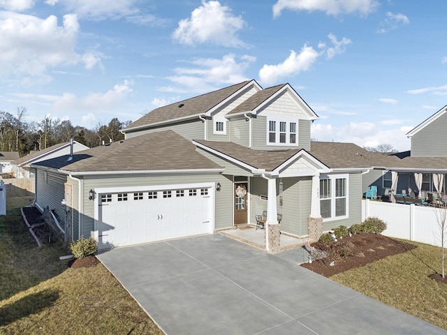 view of front of home featuring fence, an attached garage, a shingled roof, and concrete driveway