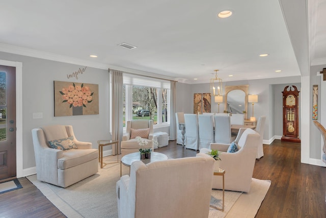 living area featuring baseboards, crown molding, wood finished floors, and recessed lighting