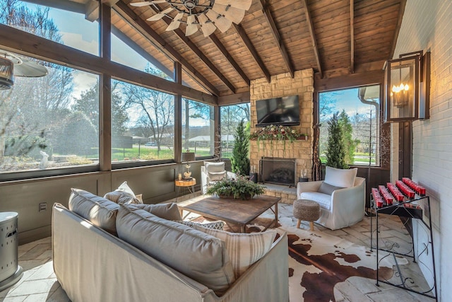 sunroom featuring a wealth of natural light, wooden ceiling, and lofted ceiling with beams
