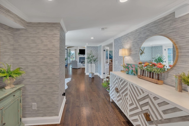 hall featuring baseboards, dark wood-style flooring, ornamental molding, and recessed lighting