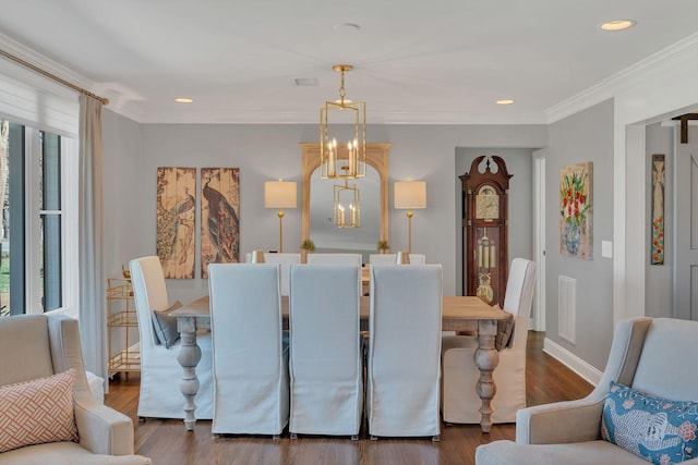 dining space featuring wood finished floors, a chandelier, baseboards, visible vents, and recessed lighting