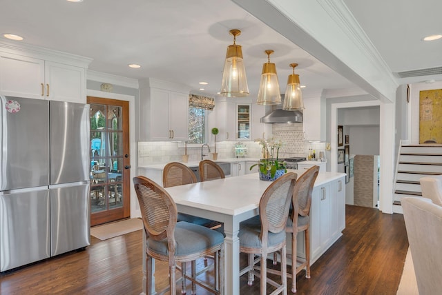 dining space featuring stairway, crown molding, dark wood finished floors, visible vents, and recessed lighting