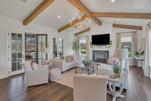 living area featuring recessed lighting, an inviting chandelier, a high end fireplace, dark wood-type flooring, and lofted ceiling with beams
