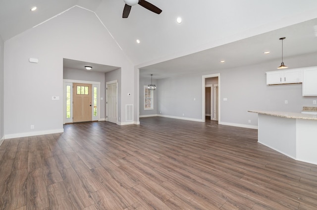 unfurnished living room featuring ceiling fan, high vaulted ceiling, dark wood finished floors, recessed lighting, and visible vents