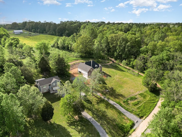 aerial view with a rural view and a wooded view