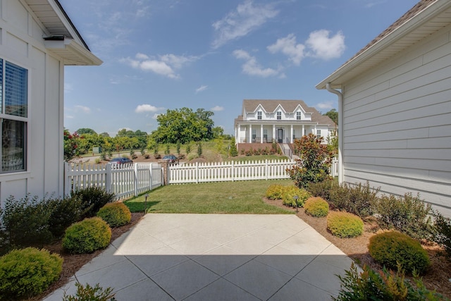 view of patio / terrace featuring fence